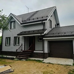 Сколько стоит обшить дом сайдингом